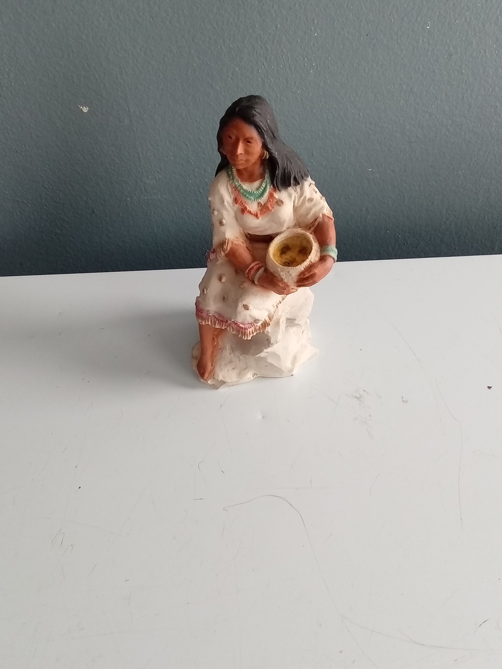 White Ceramic Seated Figurine with Turquoise and Coral Accents